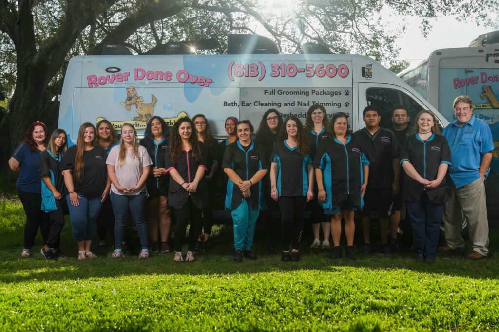 Rover Done Over Team Photo next to owners and Mobile Unit